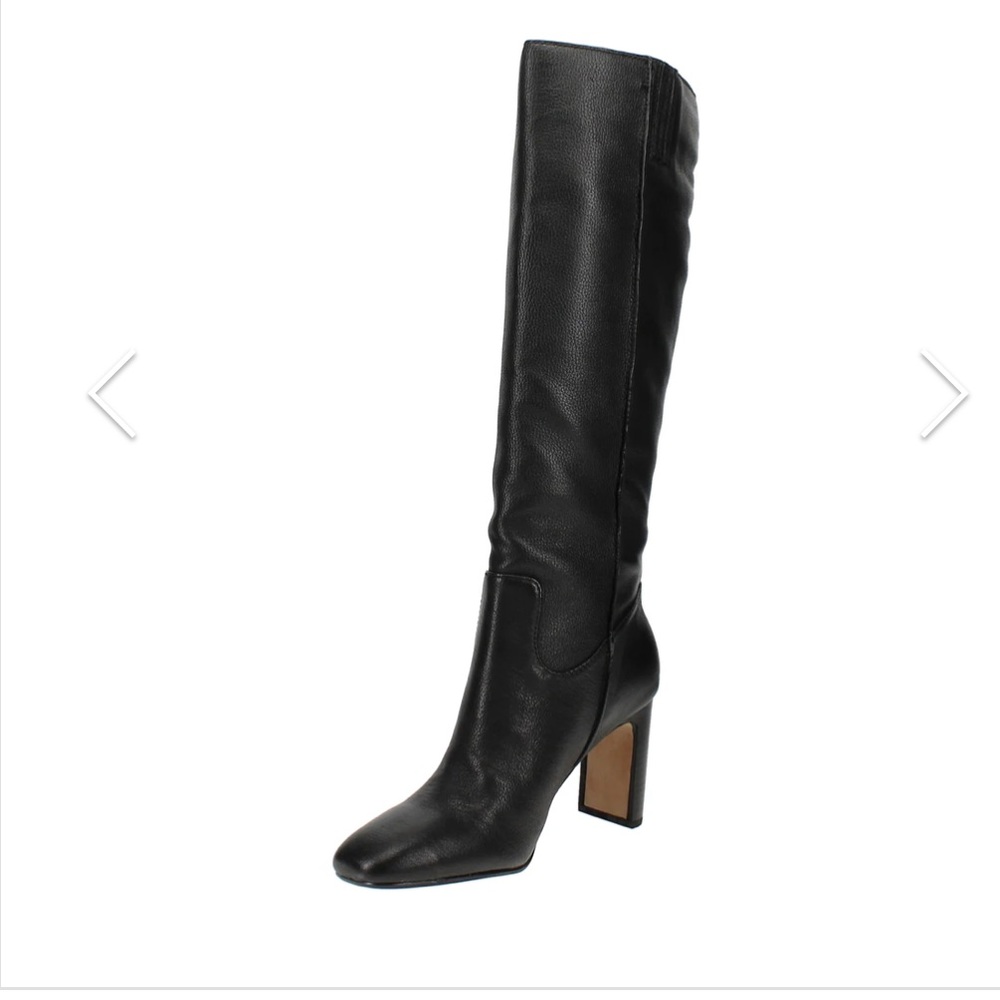 Knee high leather boots .